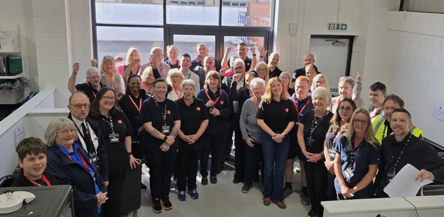 A big team photo inside the entrance of The Salvation Army Taunton donation centre